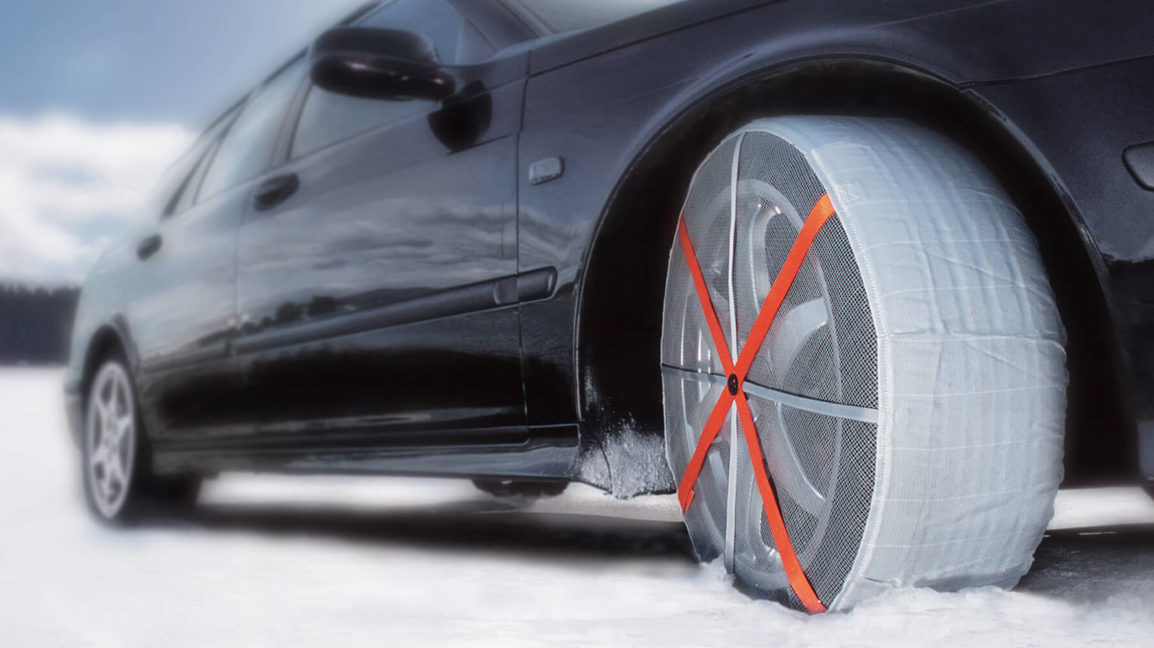 Autosock snow socks fitted to car front wheels 00