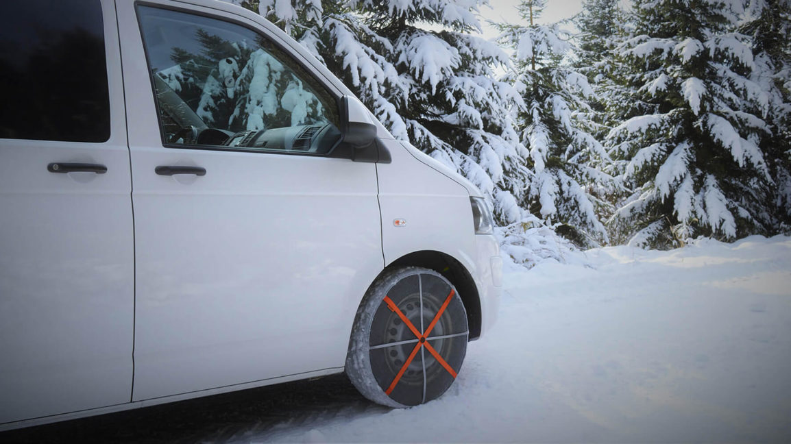 Autosock snow socks fitted to front wheel drive van 01